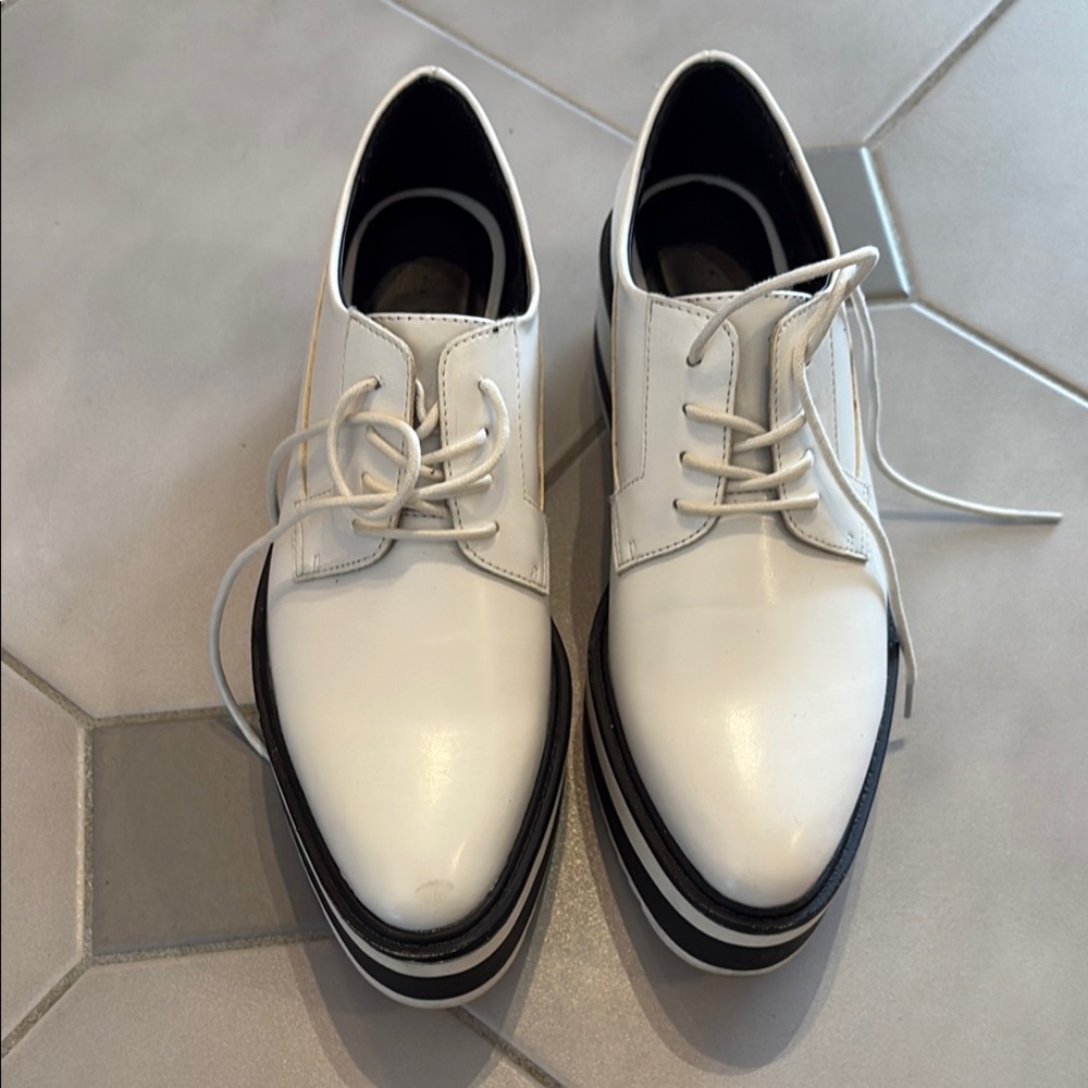 Sleek White and Black Derby Shoes with Textured Finish